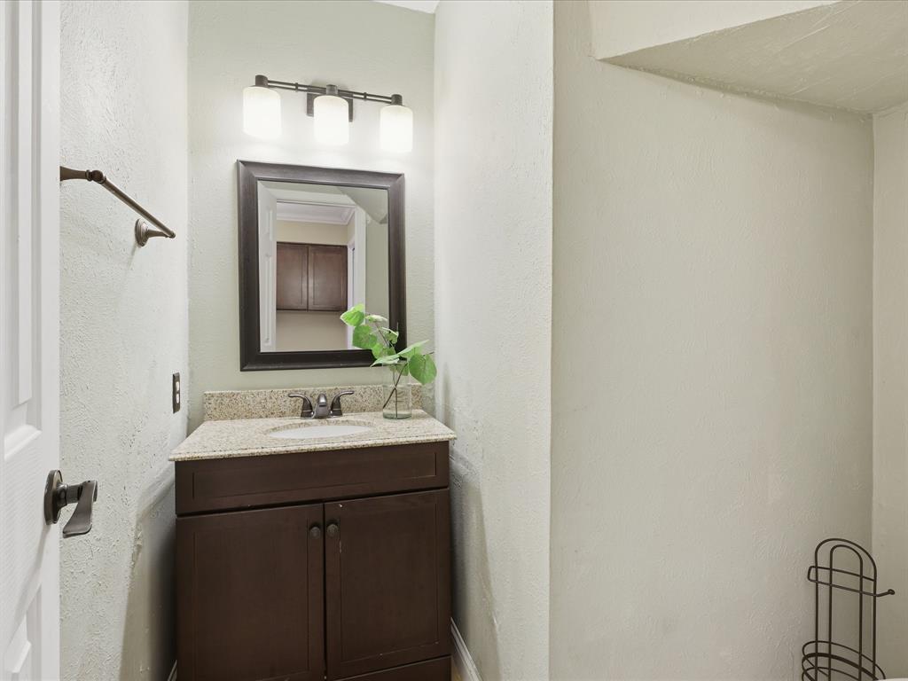 4250 Madera Road Irving, TX 75038 - Photo 19 of 31 a bathroom with a sink and a mirror
