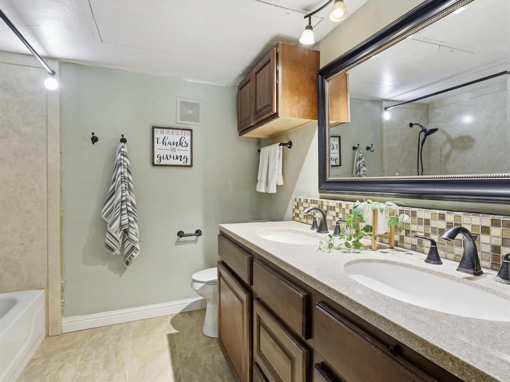 4250 Madera Road Irving, TX 75038 - Photo 24 of 31 a bathroom with a sink and a mirror