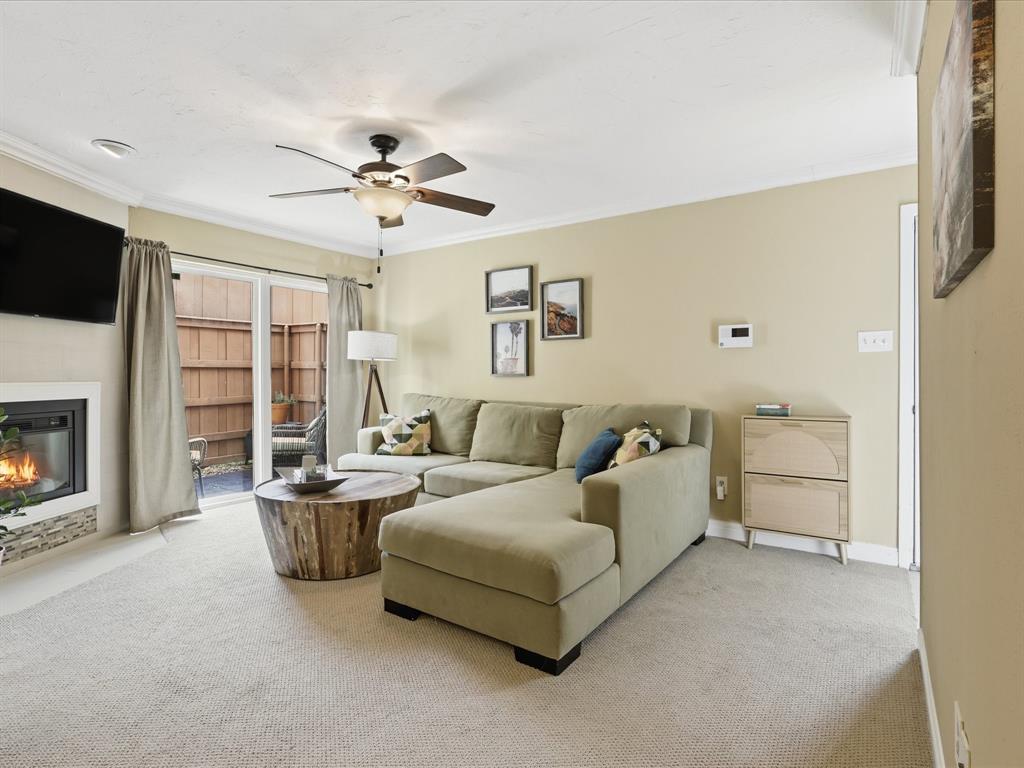 4250 Madera Road Irving, TX 75038 - Photo 4 of 31 a spacious bedroom with a bed and a fireplace
