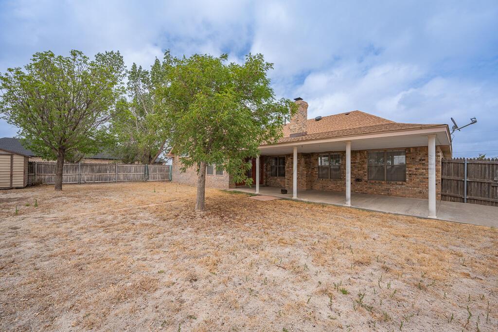19933 Indian Spring Trail Bushland, TX 79124 - Photo 29 of 32 a front view of a house with a garden