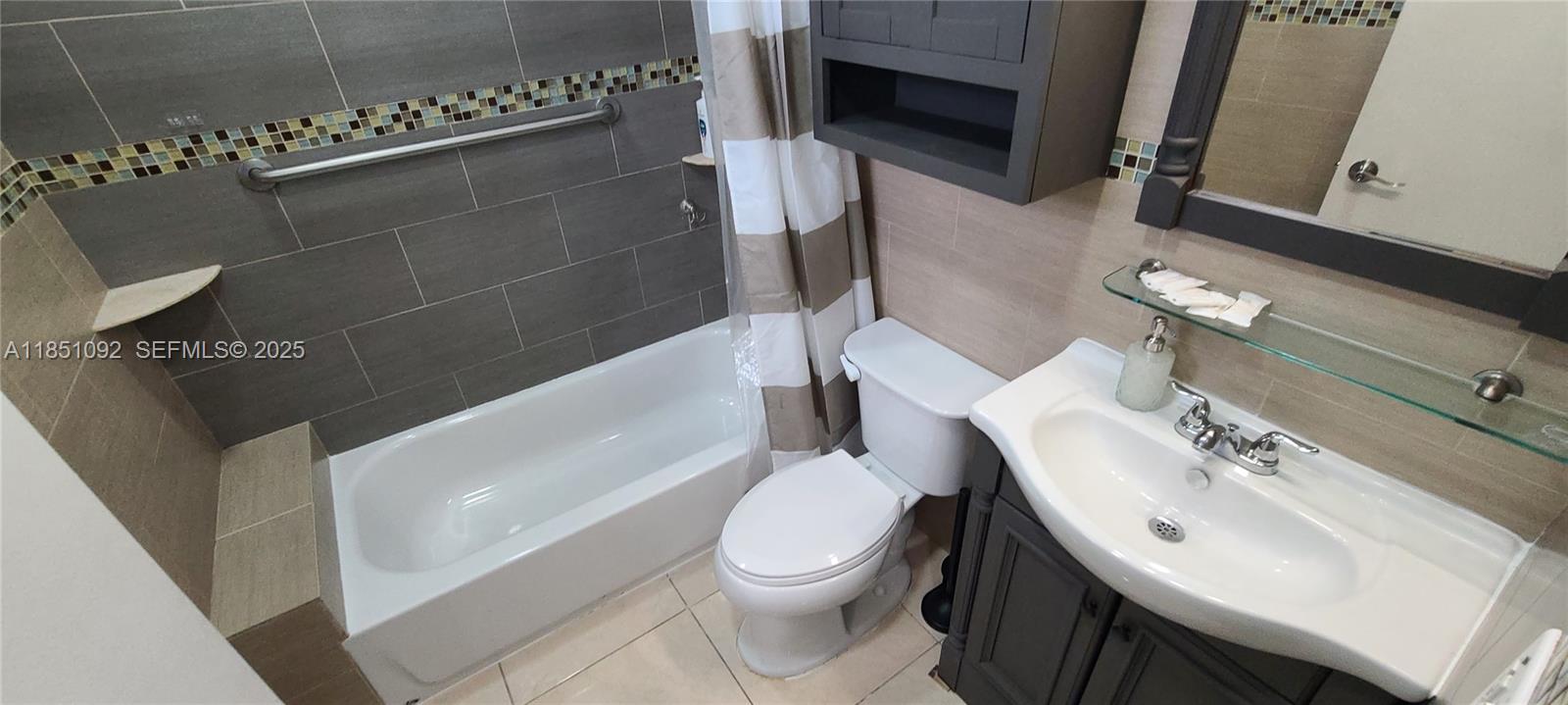 1721 Southwest 24th Terrace Miami, FL 33145 - Photo 44 of 80 a bathroom with a sink a toilet and bathtub
