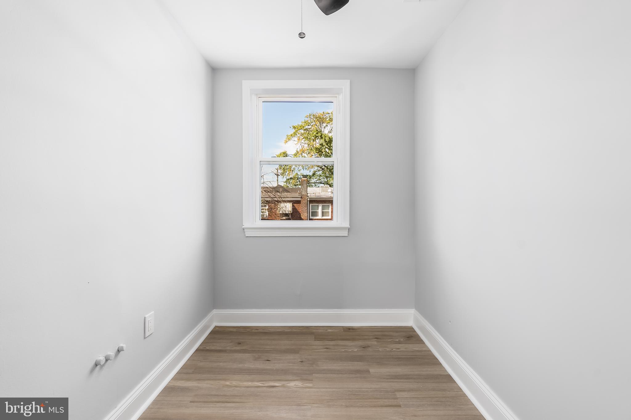 1401 18th Place Southeast Washington, DC 20020 - Photo 13 of 38 a view of hallway with window and wooden floor