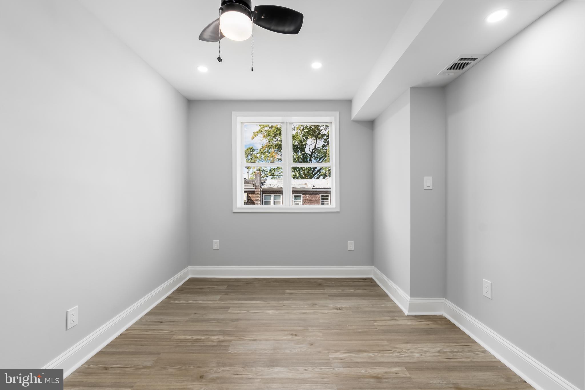 1401 18th Place Southeast Washington, DC 20020 - Photo 16 of 38 wooden floor in an empty room with a window