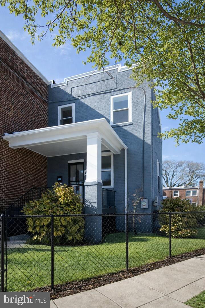 1401 18th Place Southeast Washington, DC 20020 - Photo 2 of 38 a front view of a house with a garden