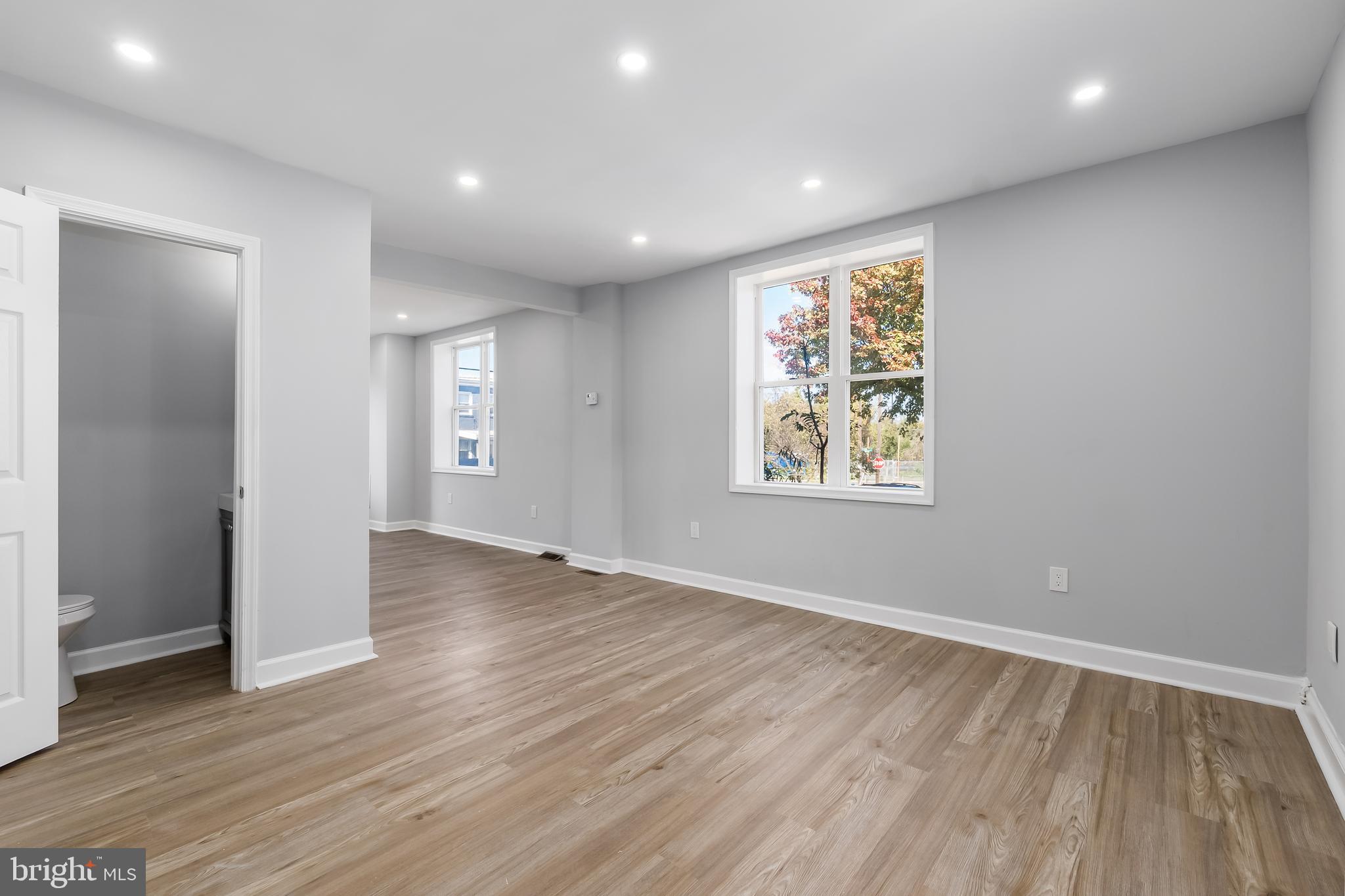 1401 18th Place Southeast Washington, DC 20020 - Photo 24 of 38 an empty room with wooden floor and windows