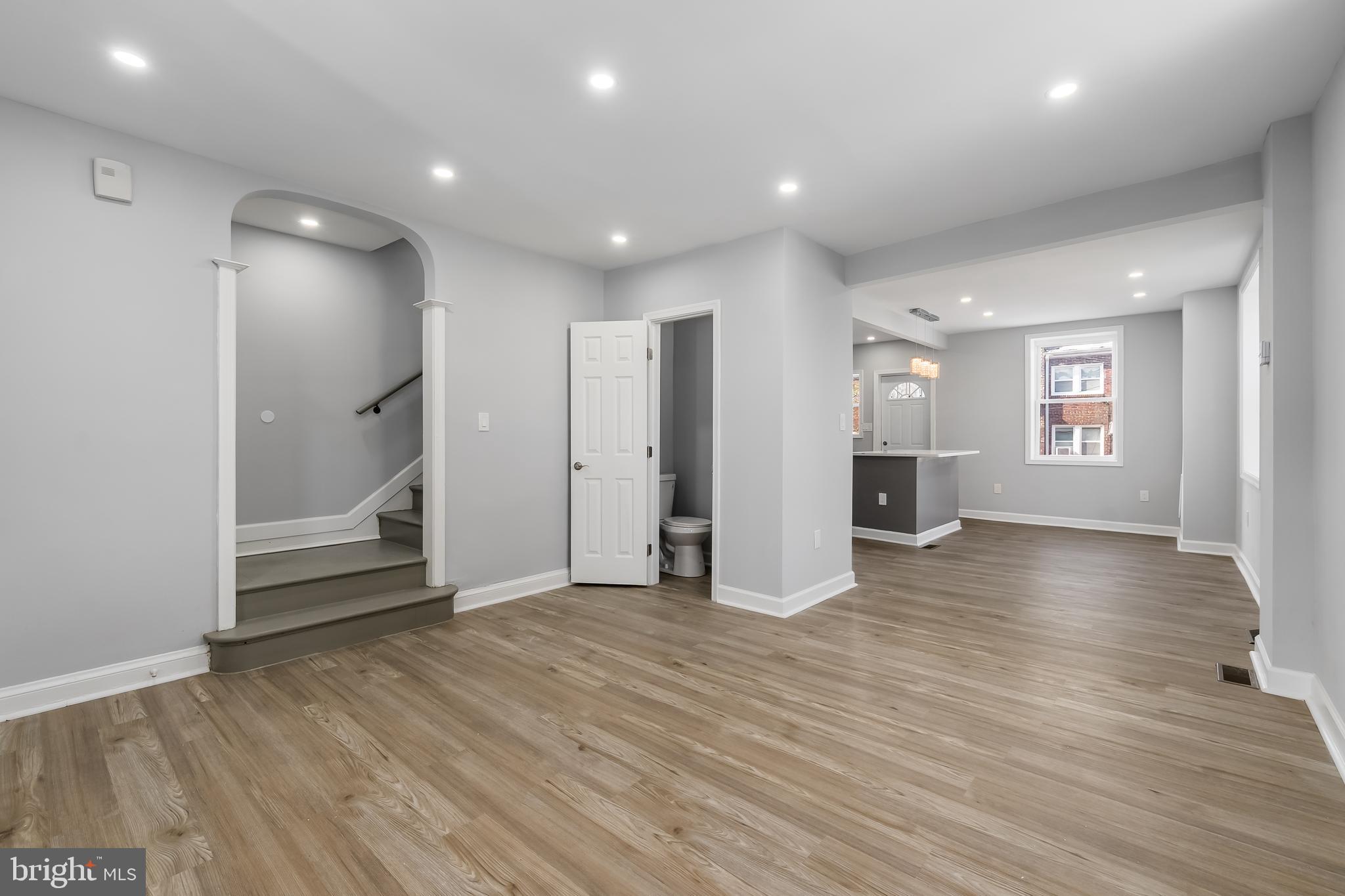 1401 18th Place Southeast Washington, DC 20020 - Photo 25 of 38 an empty room with wooden floor and windows
