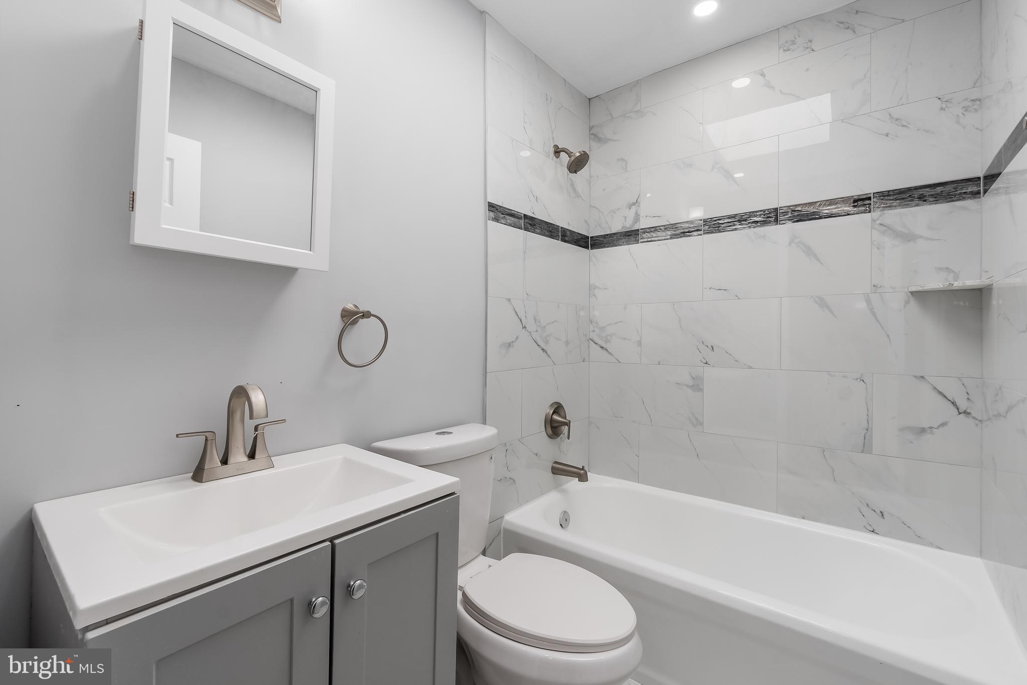 1401 18th Place Southeast Washington, DC 20020 - Photo 32 of 38 a bathroom with a sink toilet and shower