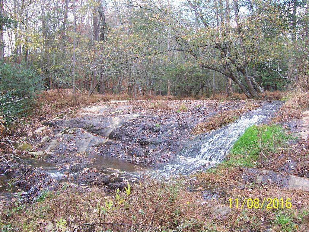 0 Gentry Road Elkin, NC 28621 - Photo 15 of 30 Little Elkin Creek runs from the upper end of the property for about 2700 ft. to the lower end of the property at the bridge.