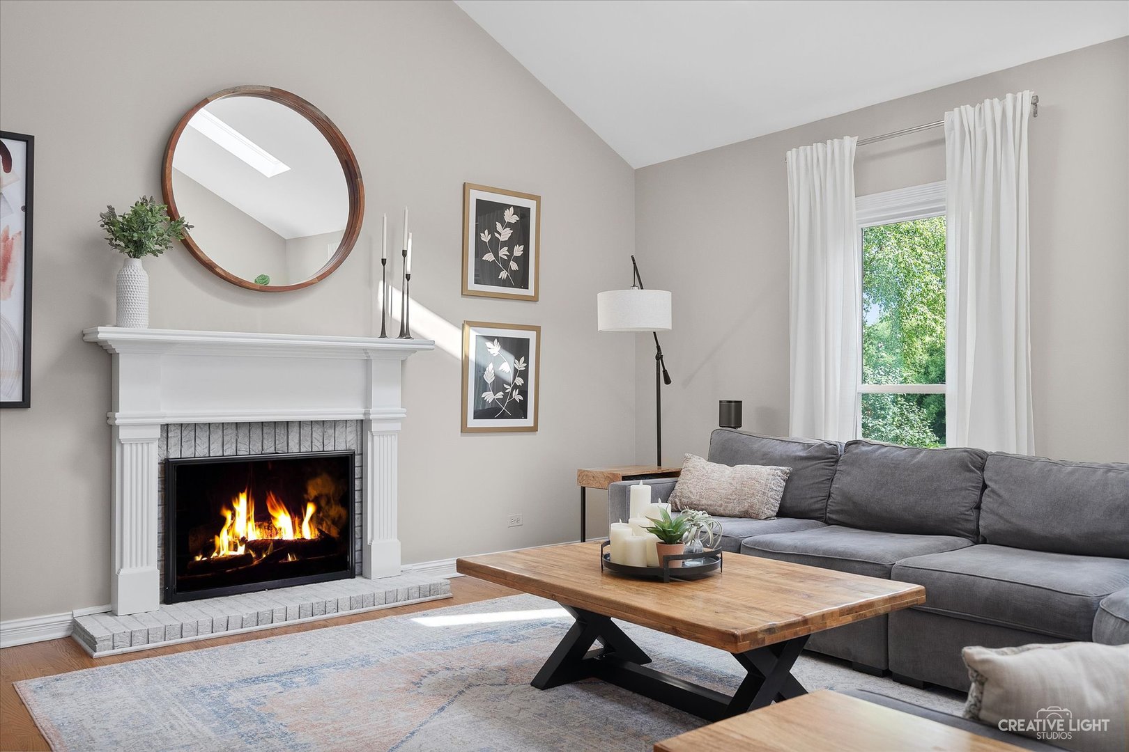 409 Flock Avenue Naperville, IL 60565 - Photo 14 of 48 a living room with furniture a fireplace and a window