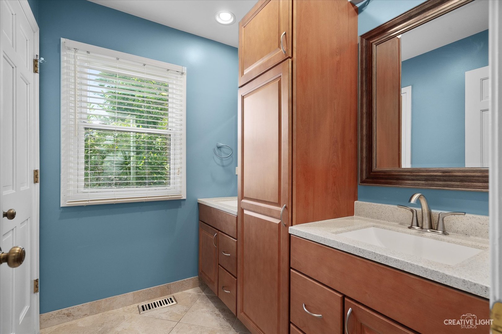 409 Flock Avenue Naperville, IL 60565 - Photo 27 of 48 a bathroom with a sink and a mirror