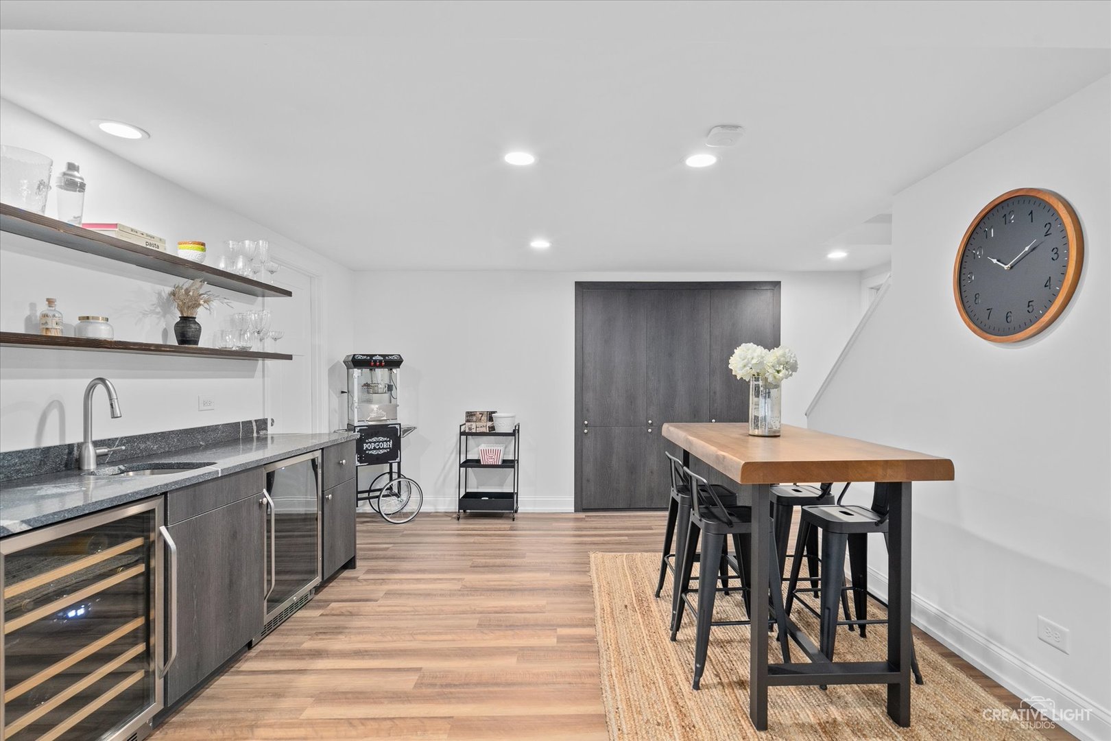 409 Flock Avenue Naperville, IL 60565 - Photo 30 of 48 a kitchen with stainless steel appliances granite countertop a table chairs sink and cabinets