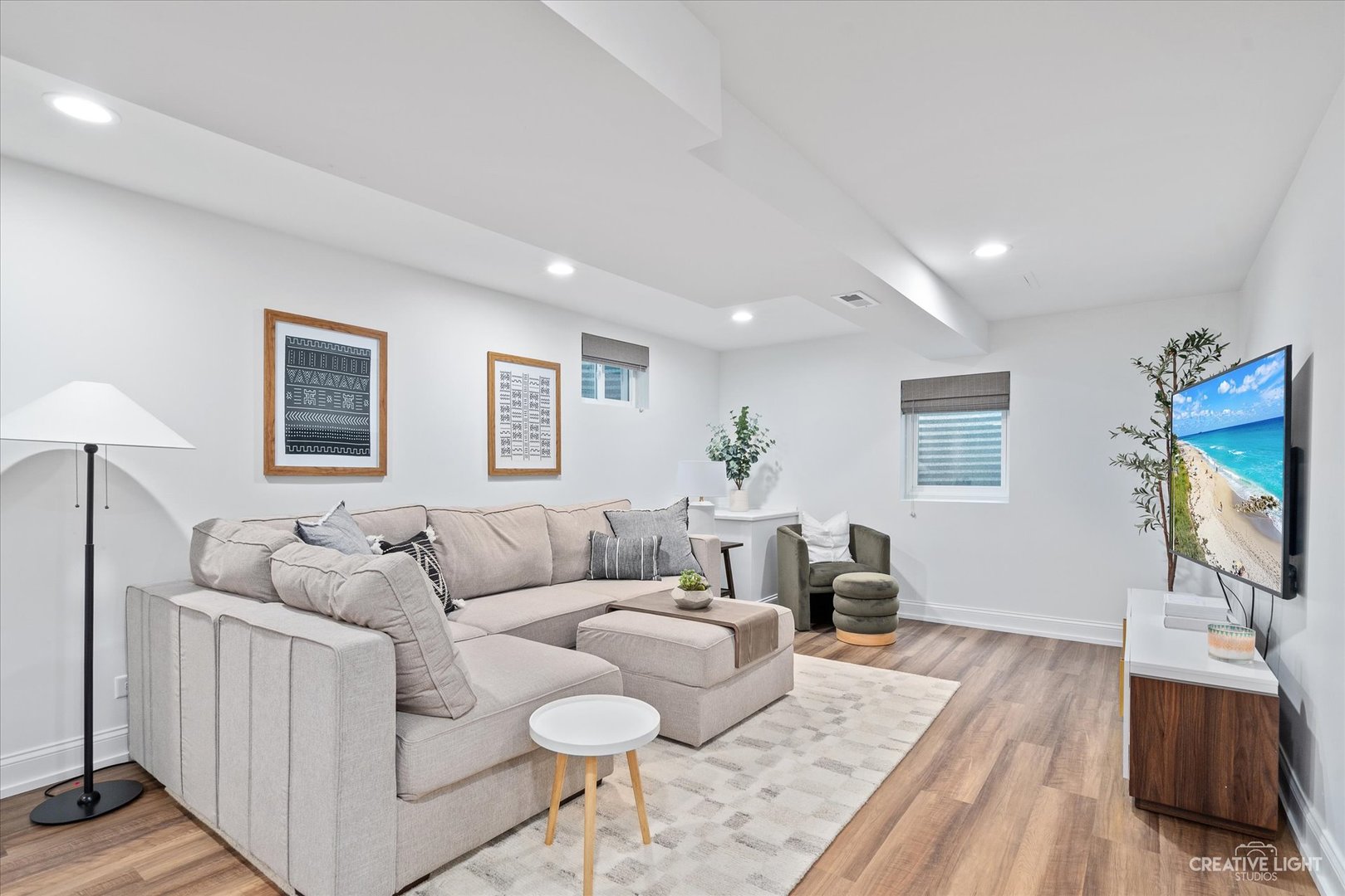 409 Flock Avenue Naperville, IL 60565 - Photo 32 of 48 a living room with furniture and a flat screen tv