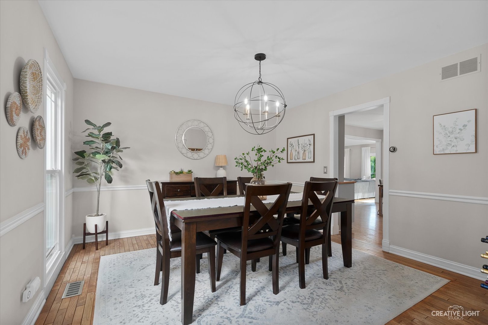 409 Flock Avenue Naperville, IL 60565 - Photo 7 of 48 a view of a dining room with furniture and chandelier