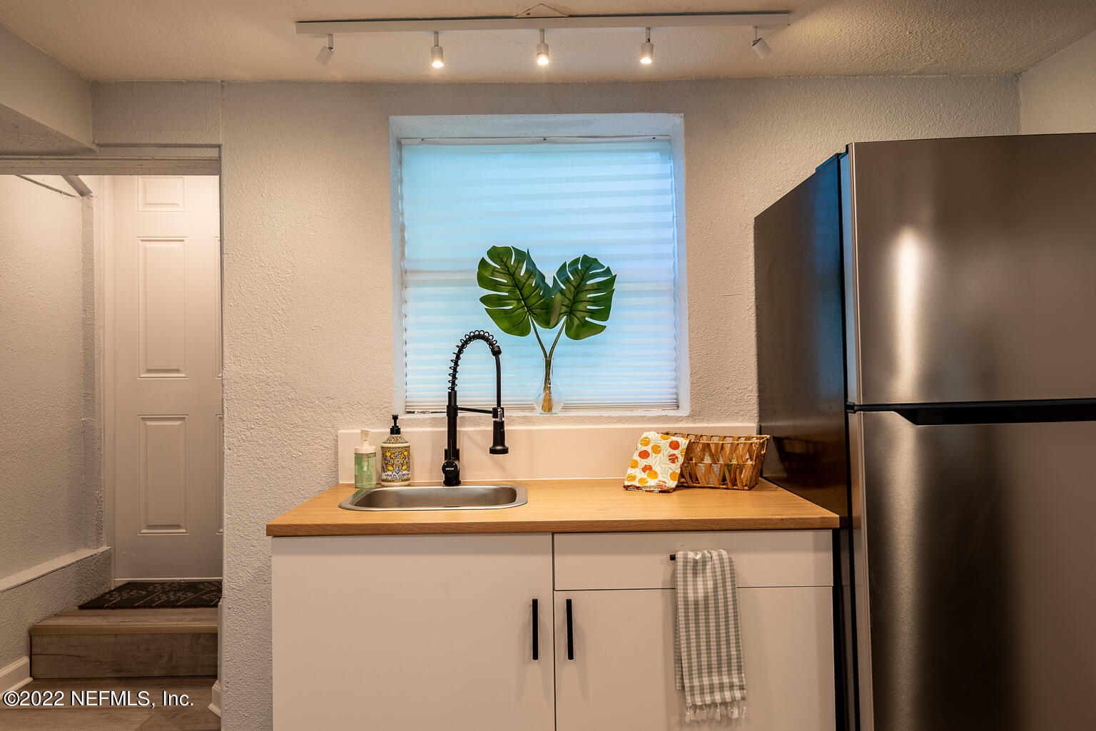 5150 107th Street Jacksonville, FL 32244 - Photo 20 of 43 a bathroom with a sink a mirror and a shower
