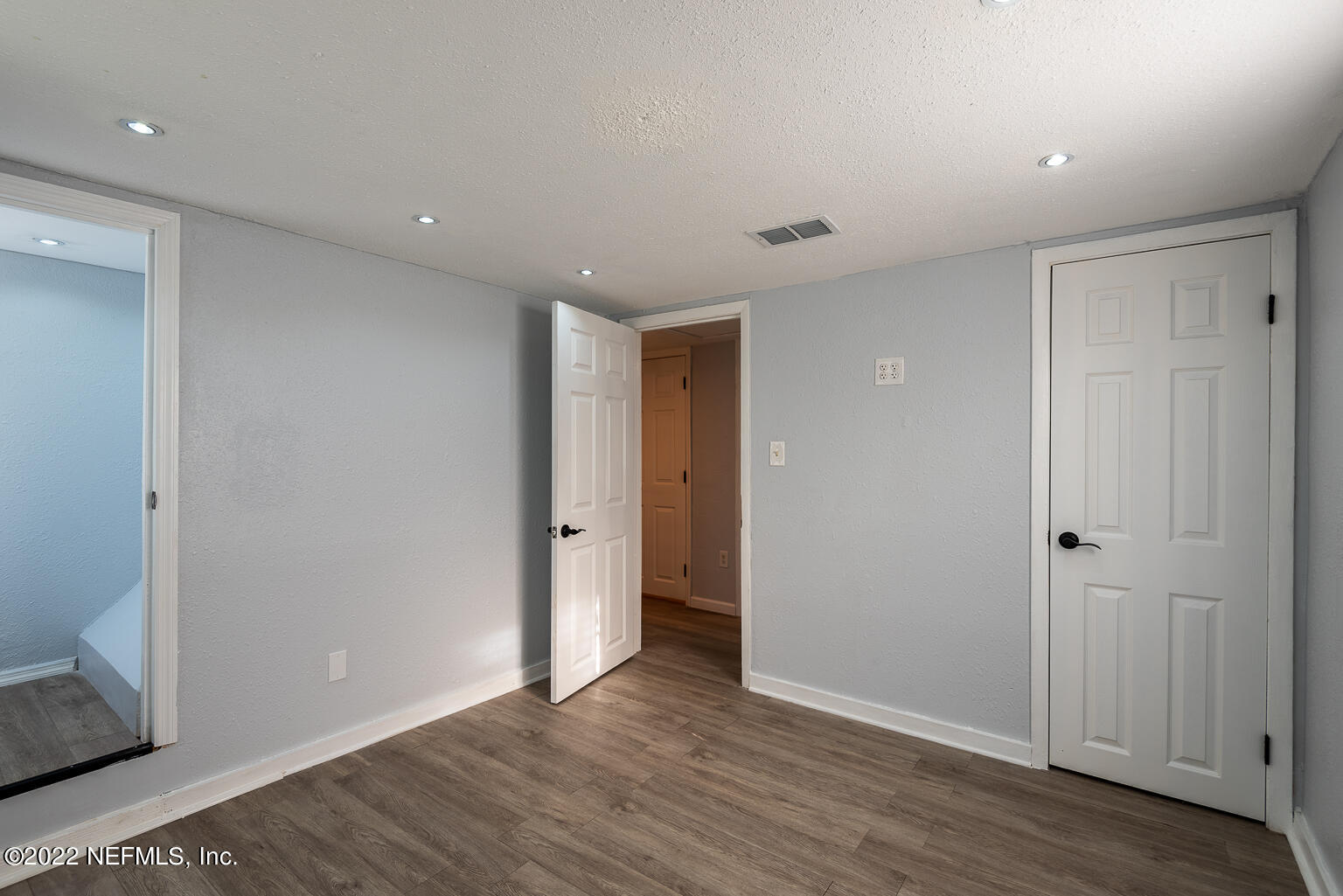 5150 107th Street Jacksonville, FL 32244 - Photo 39 of 43 a view of an empty room with wooden floor and closet