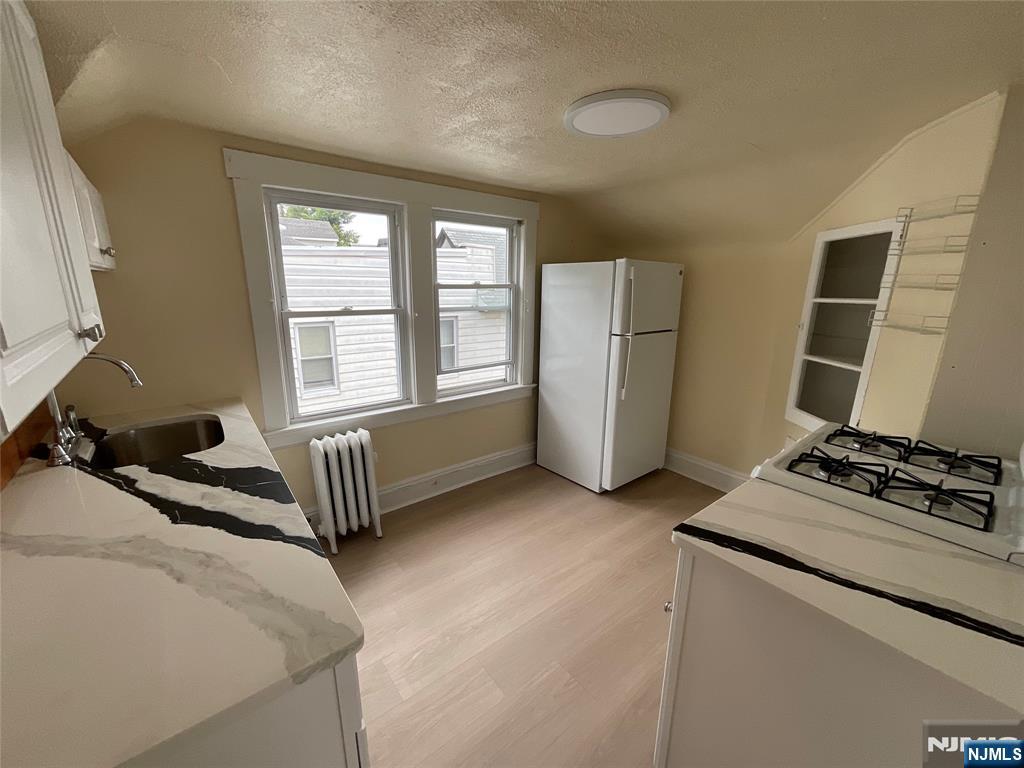 131 Delafield Avenue, Unit 3 Lyndhurst, NJ 07071 - Photo 9 of 15 a bedroom with bed and a window