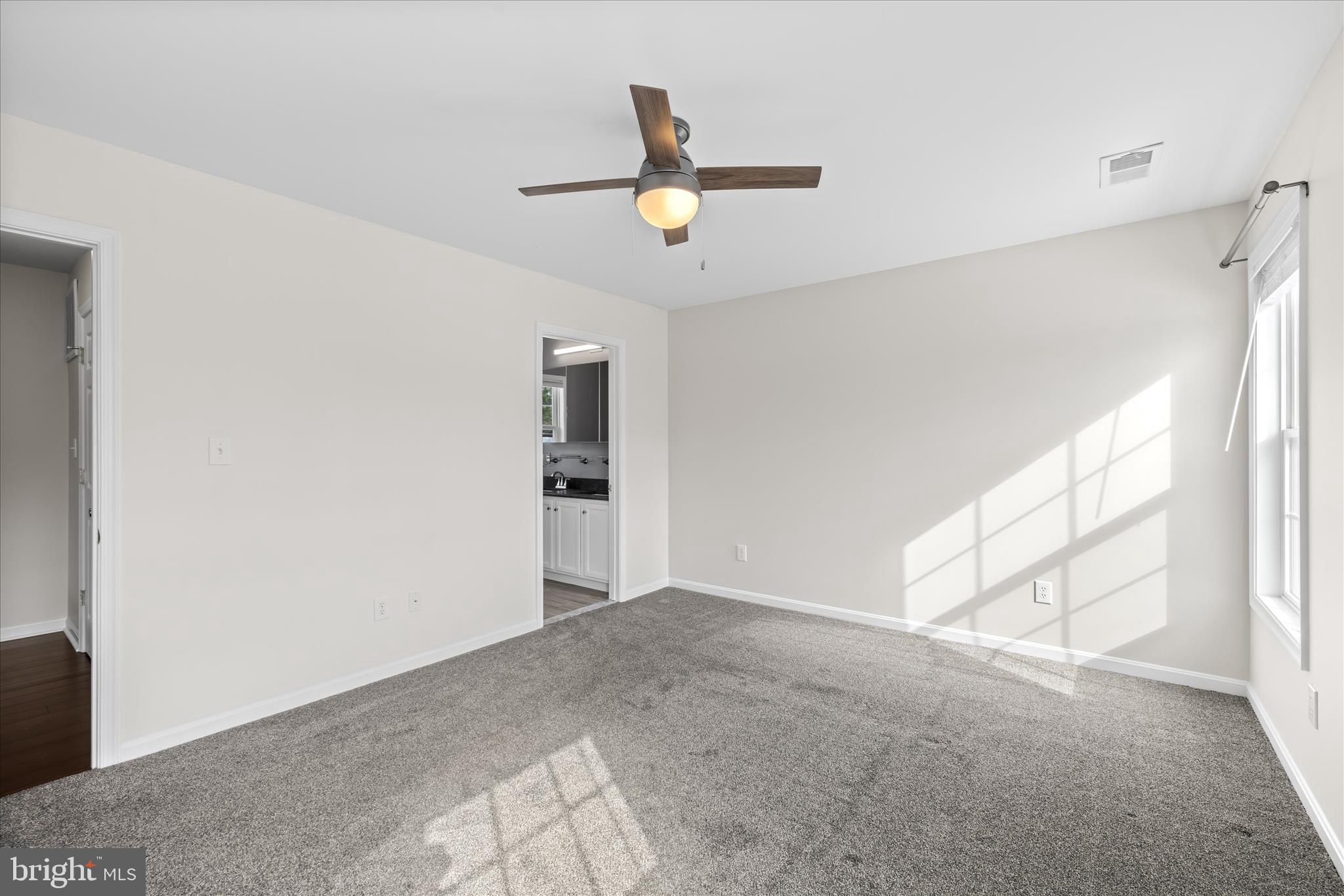 19095 Carey Lane Georgetown, DE 19947 - Photo 19 of 39 a view of empty room with wooden floor and fan
