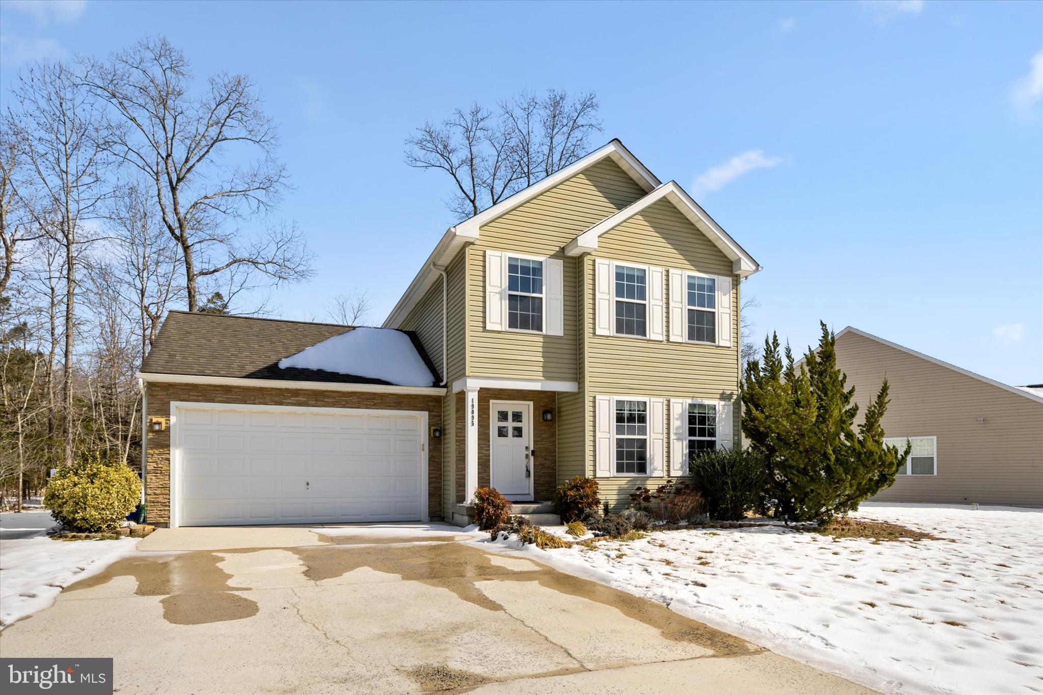 19095 Carey Lane Georgetown, DE 19947 - Photo 2 of 39 a front view of a house with a yard