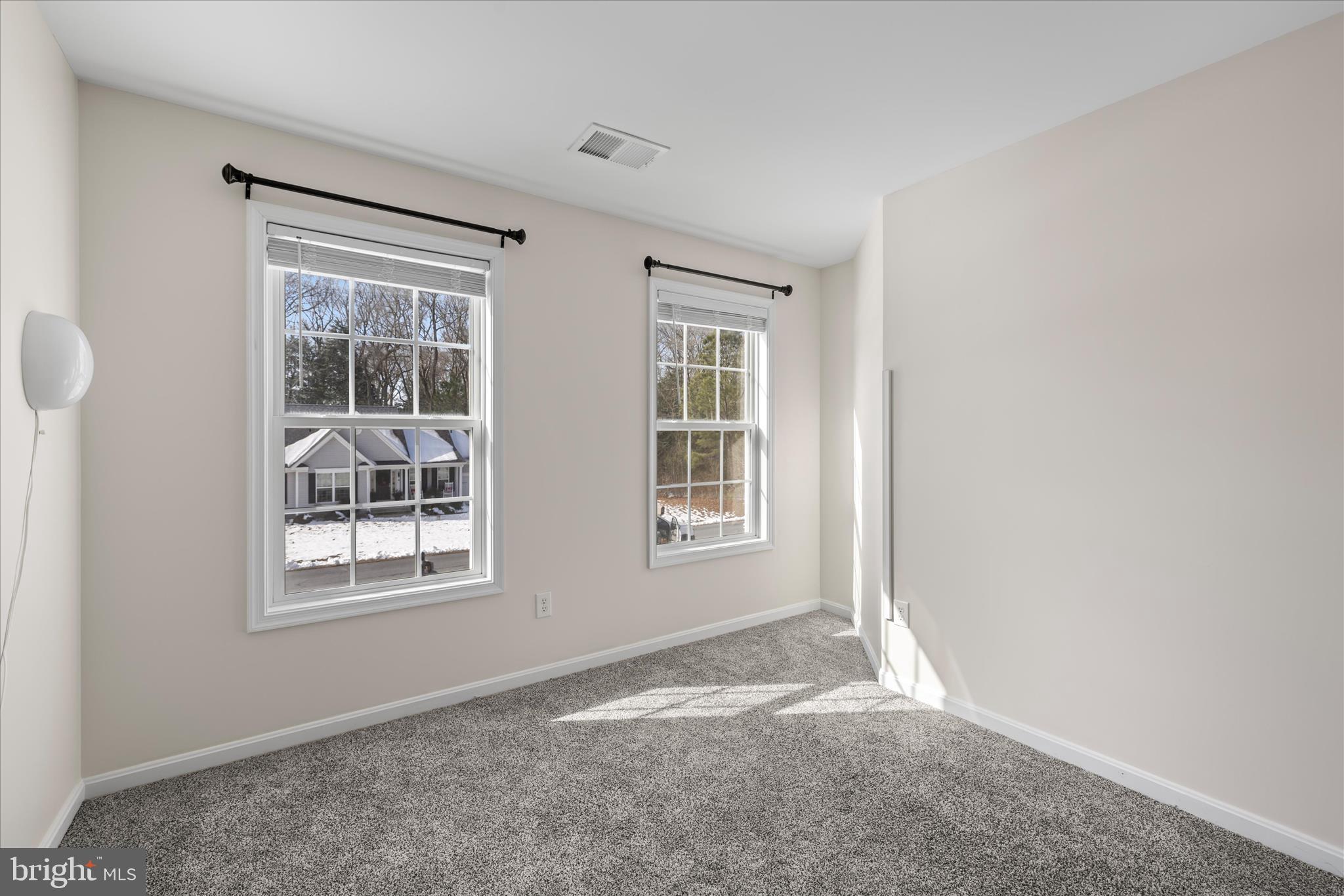 19095 Carey Lane Georgetown, DE 19947 - Photo 23 of 39 an empty room with windows