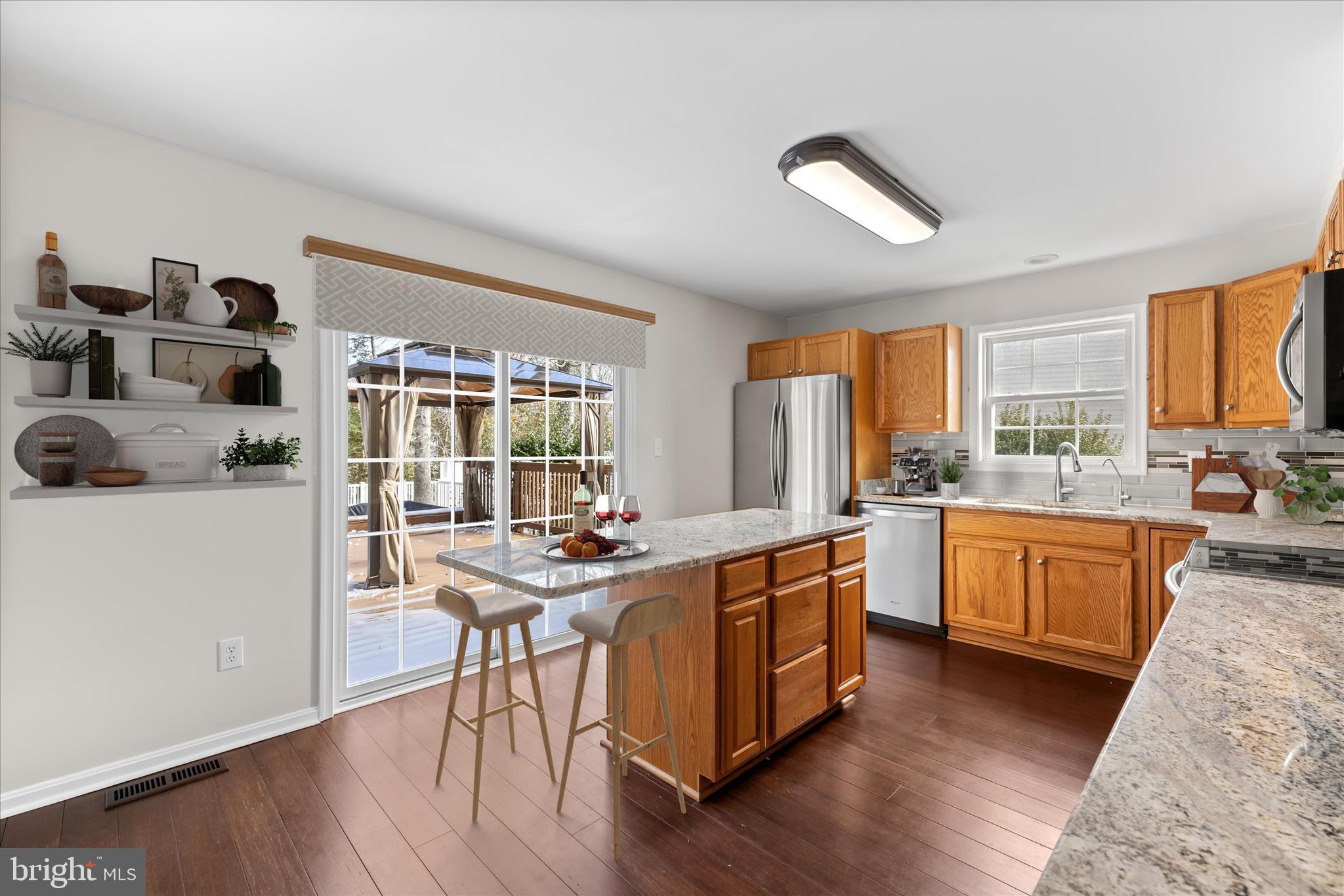 19095 Carey Lane Georgetown, DE 19947 - Photo 8 of 39 a view of a kitchen counter space with wooden floor and stainless steel appliances