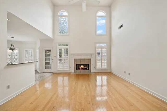 a view of livingroom with fireplace wooden floor and window