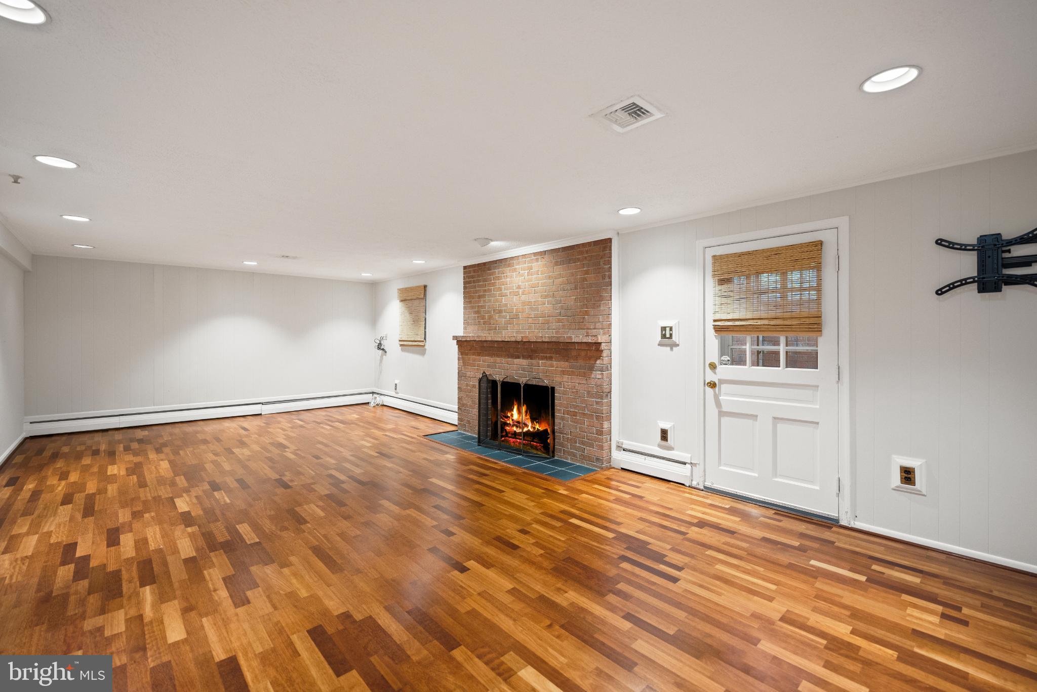 6710 Wemberly Way McLean, VA 22101 - Photo 36 of 46 Lowe level rec room w/ gas fireplace