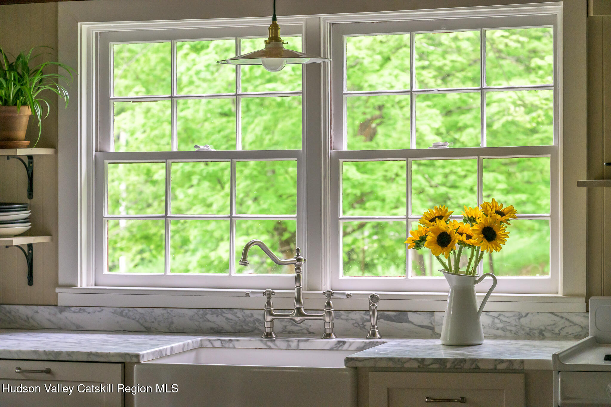 1963 County Rte 5 Canaan, NY 12029 - Photo 14 of 46 a vase of flowers sitting on a window sill