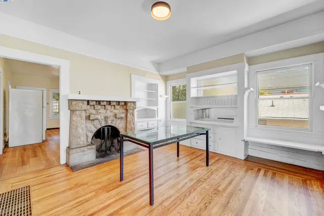 a view of a room with wooden floor wooden floor and windows
