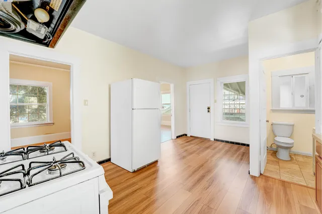 a kitchen with stainless steel appliances granite countertop a sink and a window