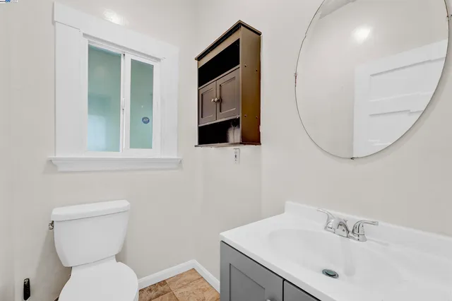 a view of a kitchen with a sink and cabinets