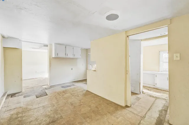 a view of a house with a small yard and plants