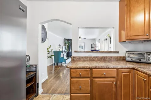 a kitchen with cabinets and outdoor view