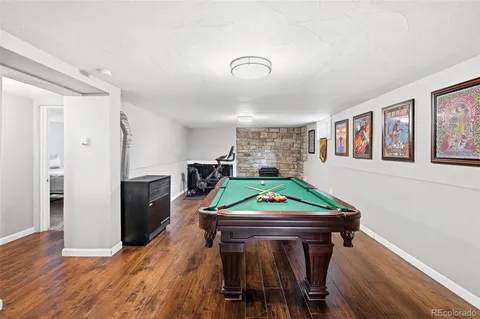 a room with furniture and a pool table
