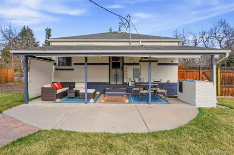a view of a house with a patio and a slide