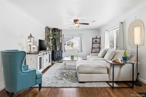 a living room with furniture fireplace and flat screen tv