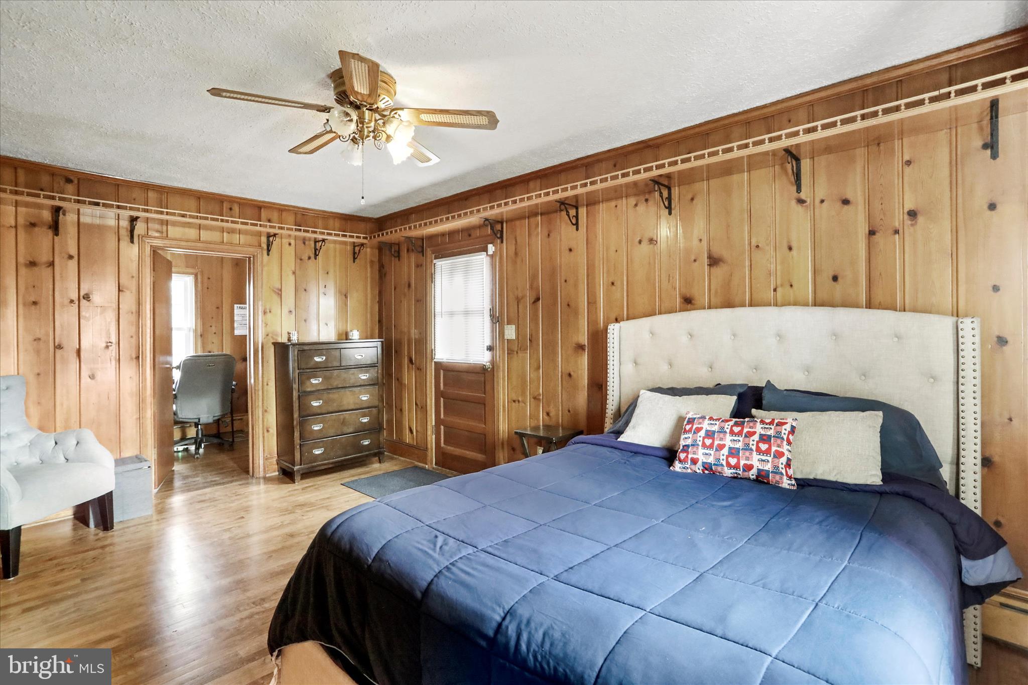 425 West 15th Street Front Royal, VA 22630 - Photo 18 of 47 a bedroom with a bed and wooden floor