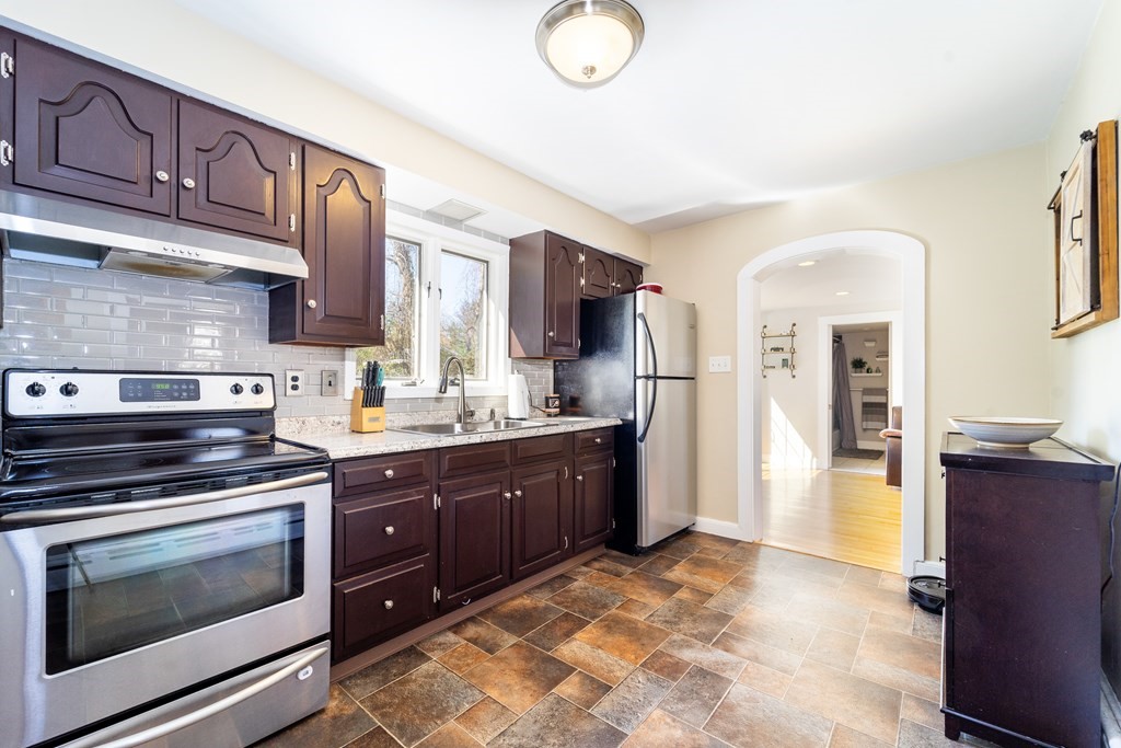 30 County Road Freetown, MA 02717 - Photo 17 of 35 a kitchen with stainless steel appliances granite countertop a stove a sink and a refrigerator