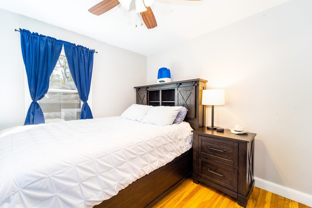 30 County Road Freetown, MA 02717 - Photo 25 of 35 a bedroom with a bed and a window with wooden floor
