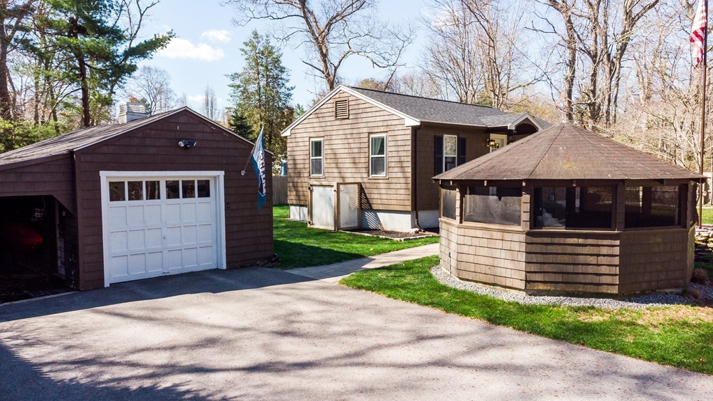 30 County Road Freetown, MA 02717 - Photo 6 of 35 a front view of a house with a yard and garage