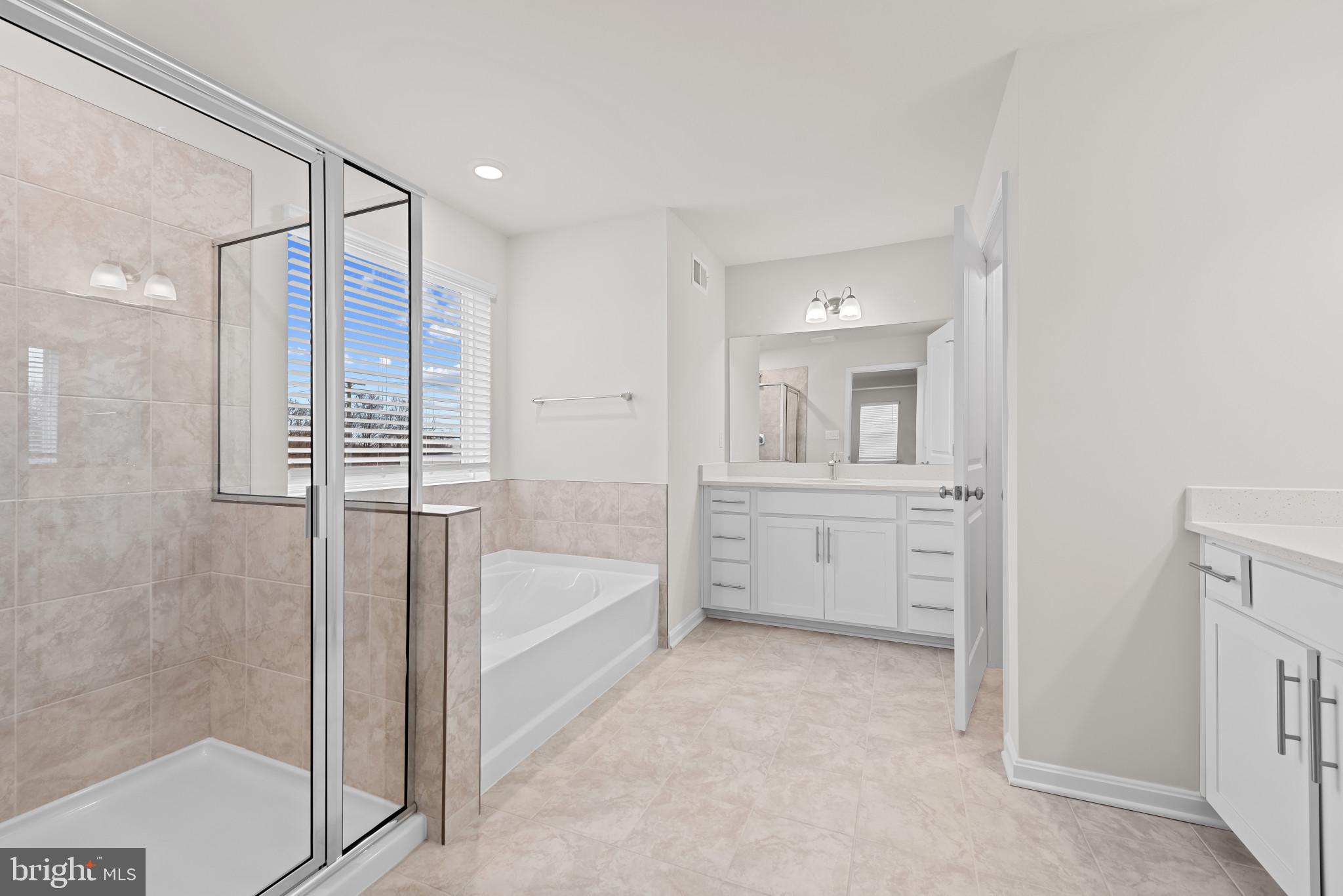 8103 Cypress Pt Drive Rosedale, MD 21237 - Photo 27 of 45 a bathroom with a tub shower and sink