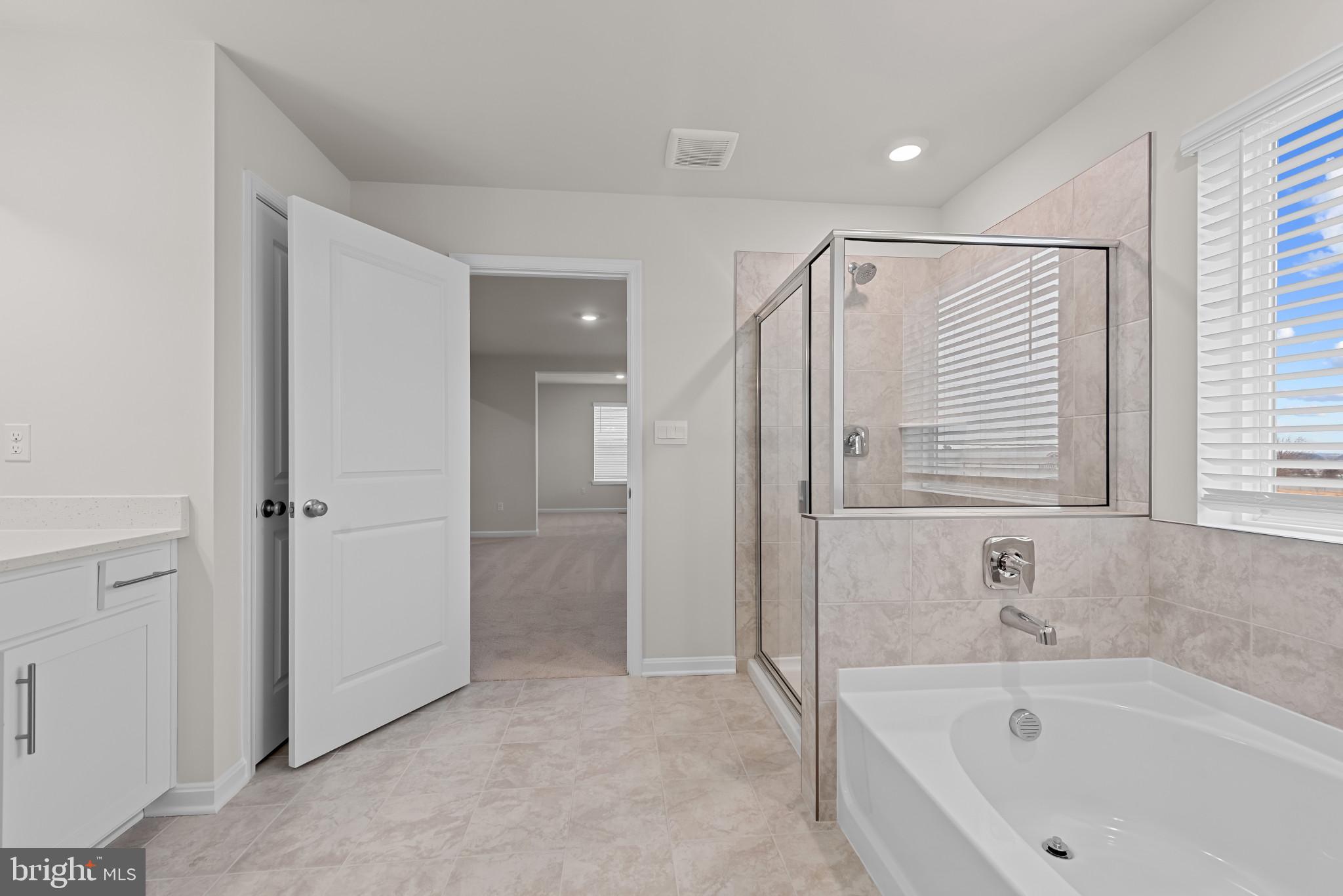8103 Cypress Pt Drive Rosedale, MD 21237 - Photo 28 of 45 a bathroom with a bathtub and a shower