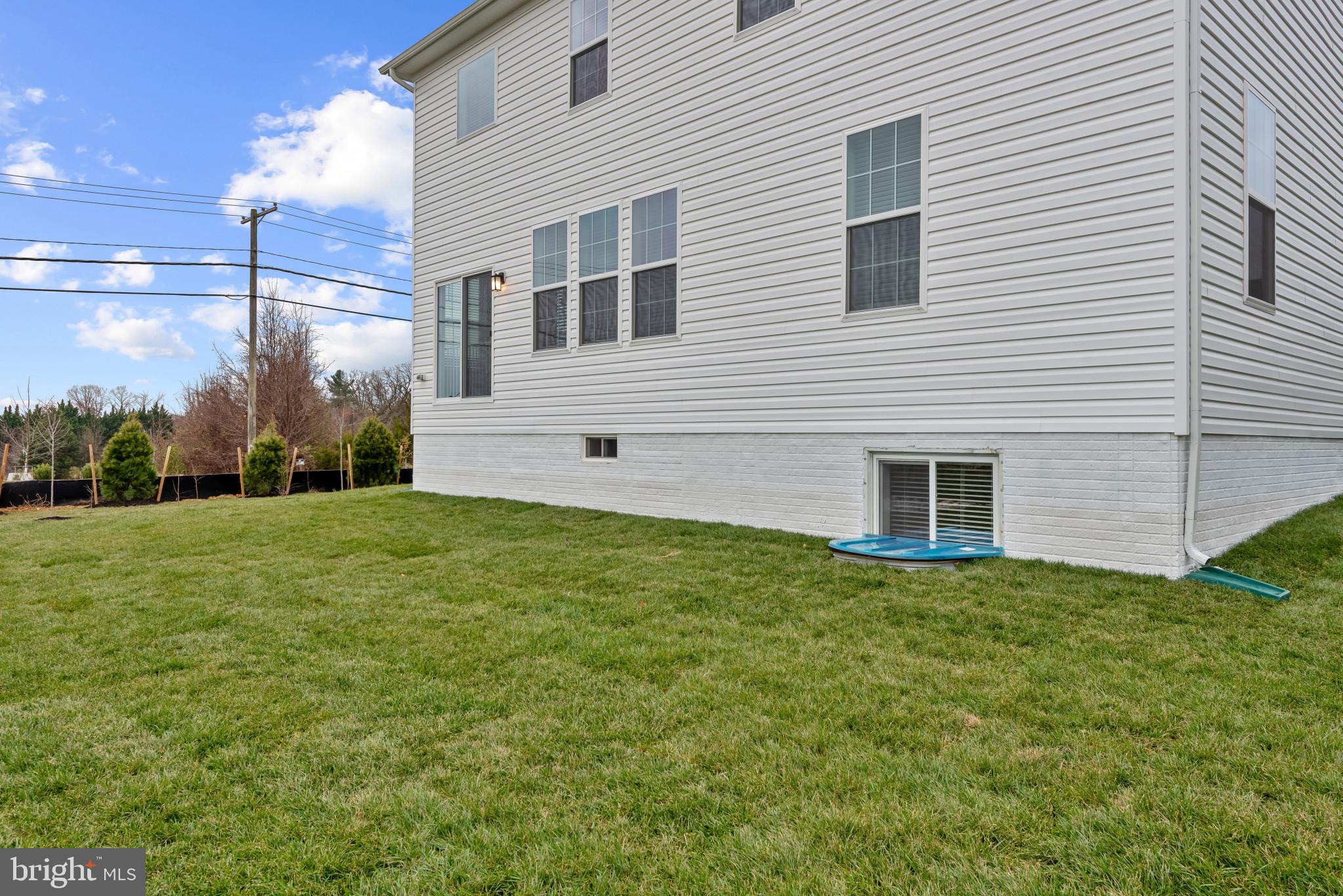 8103 Cypress Pt Drive Rosedale, MD 21237 - Photo 33 of 45 a view of a house with a yard