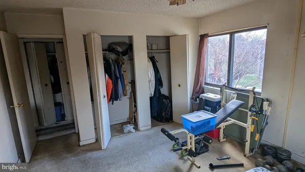 a view of a room with furniture and a window