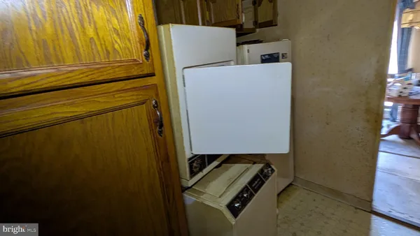 a view of storage and utility room with a window