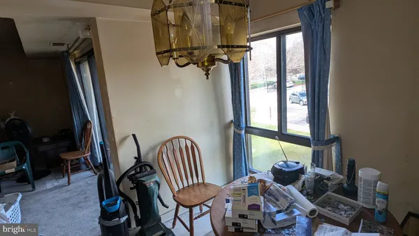 a view of a room with furniture and windows