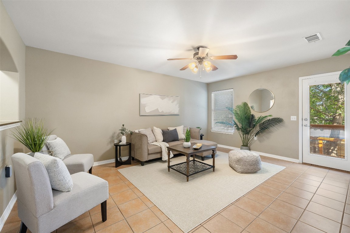 6220 Seville Drive Austin, TX 78724 - Photo 1 of 1 a living room with furniture potted plant and a window