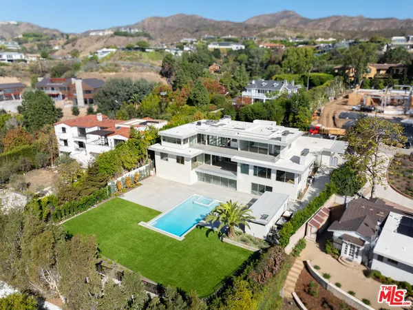 an aerial view of a house with a garden