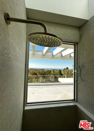 a view of a glass door and a window