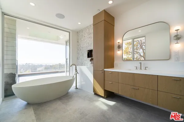 a bathroom with a bathtub and a sink