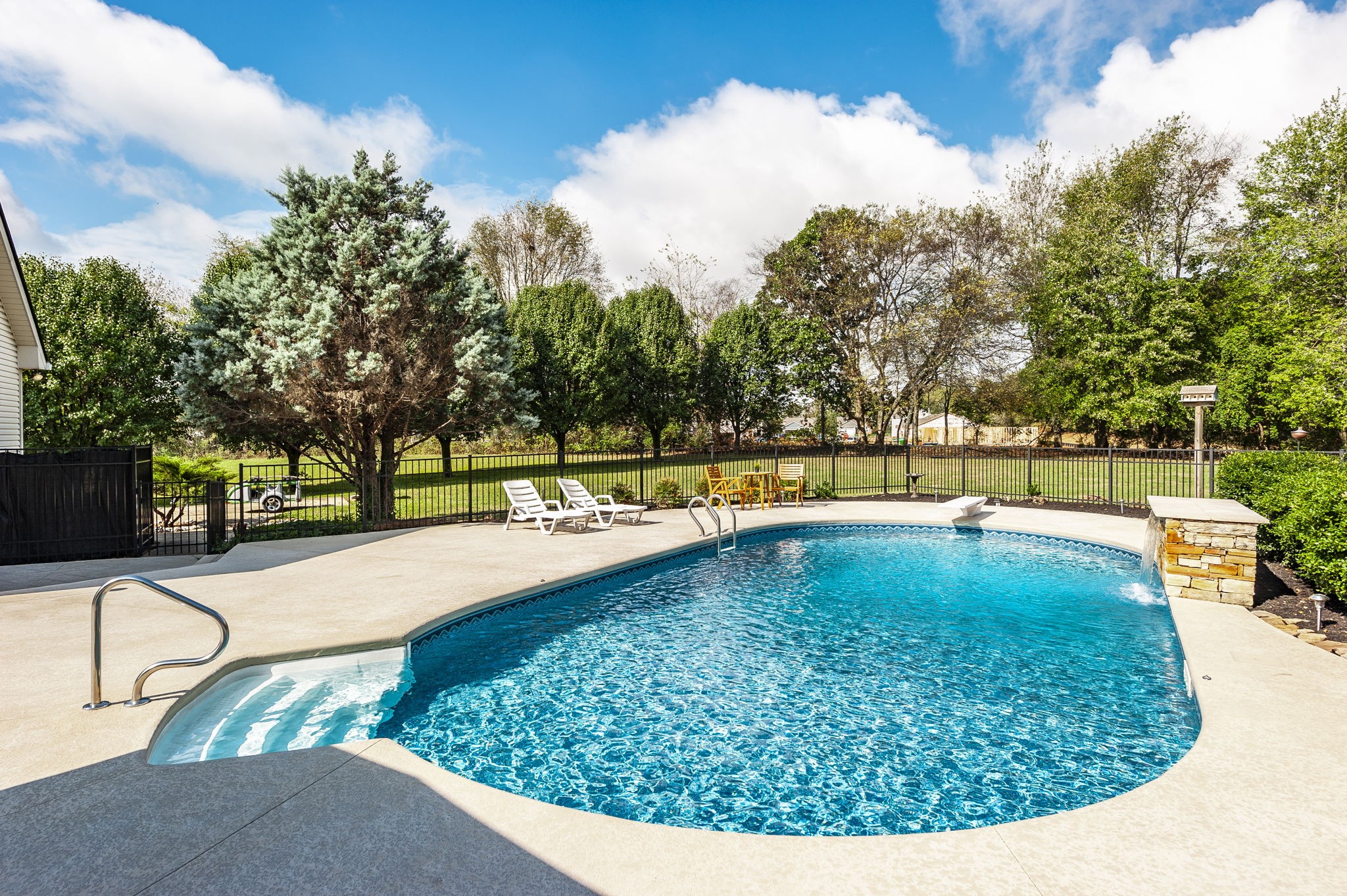 a view of a swimming pool with a patio
